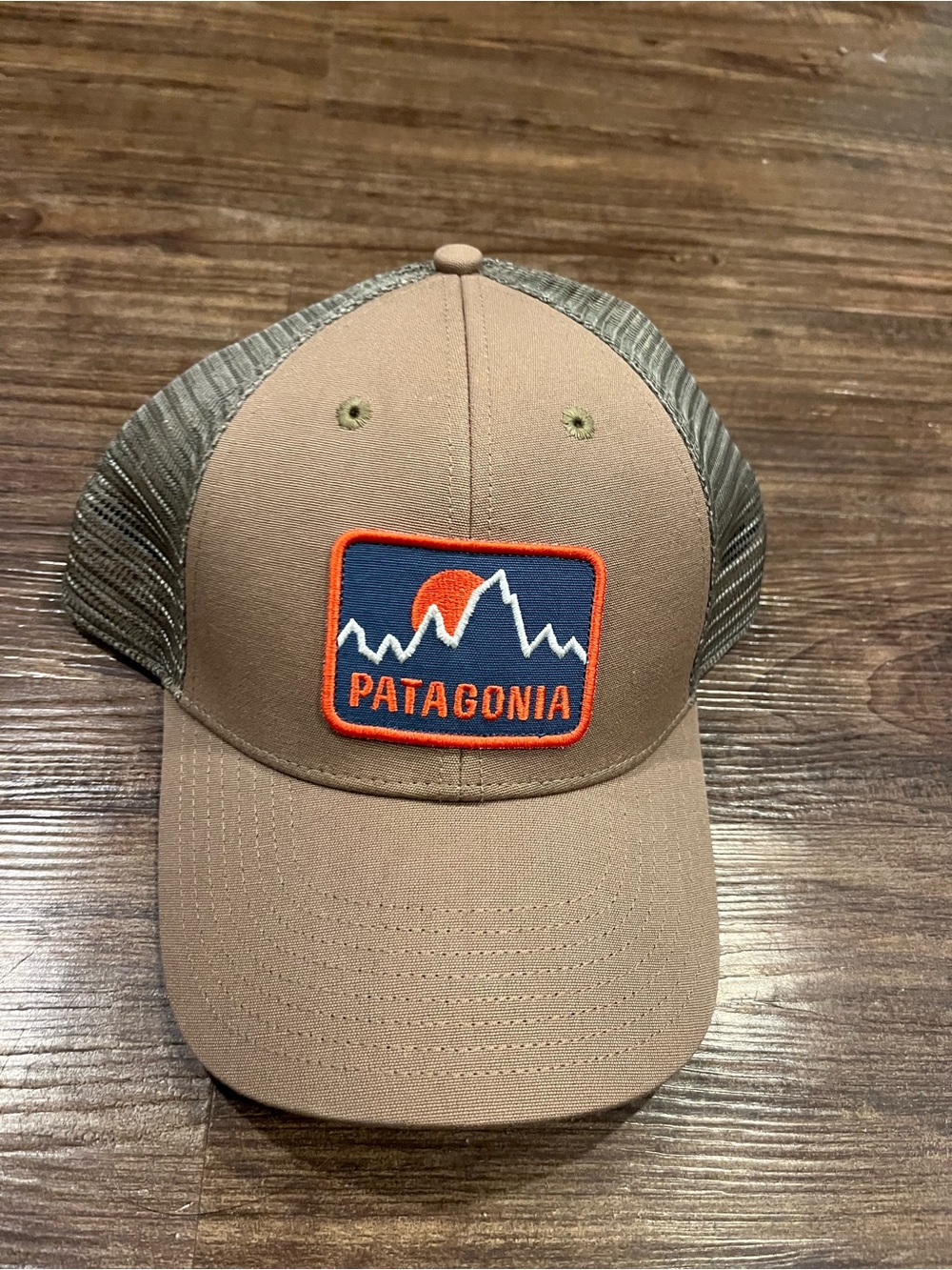 Patagonia Tanish green Trucker Hat with Blue & Orange Patch one size fits all